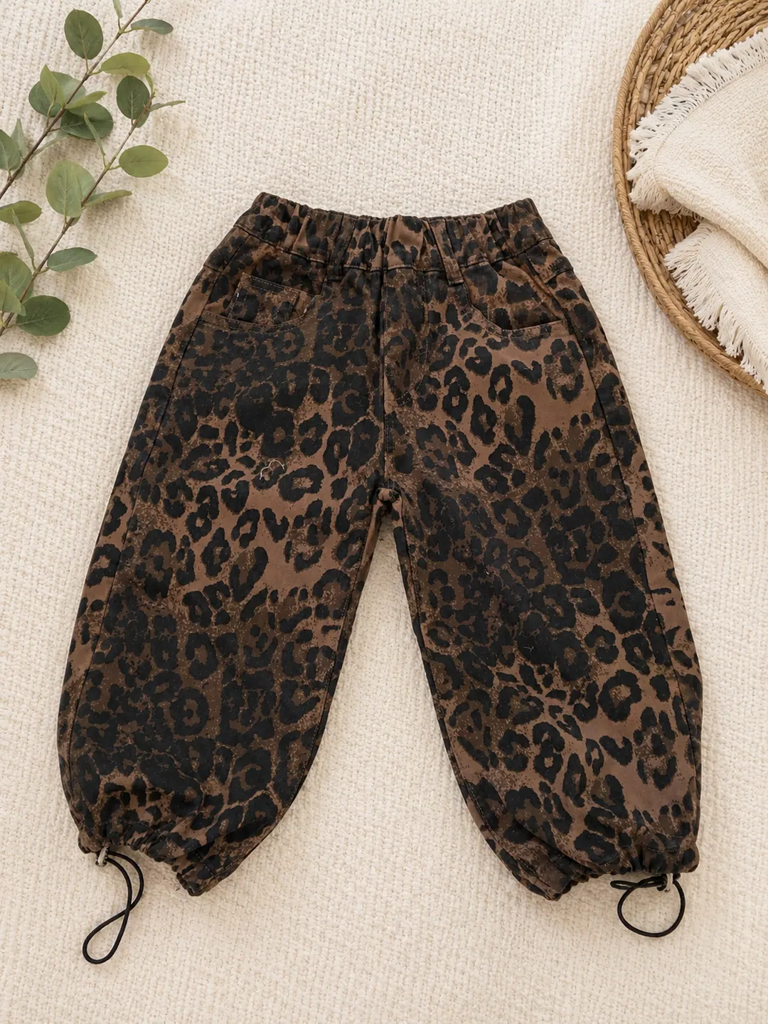 Leopard-print baby trousers with drawstring hems