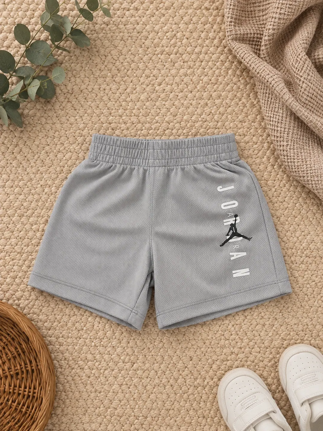 Grey Jordan baby shorts with a Jumpman print